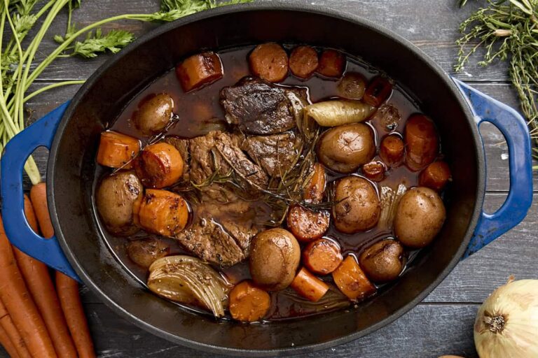 Overhead view of a pot roast in a dutch oven.