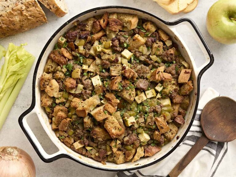 Overhead view of sausage stuffing in a casserole dish.