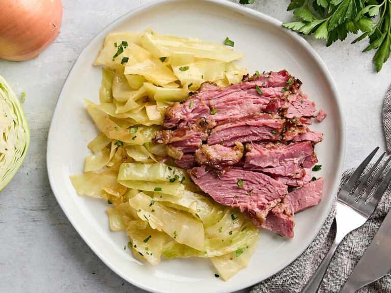 Overhead view of a plate of corned beef and cabbage.