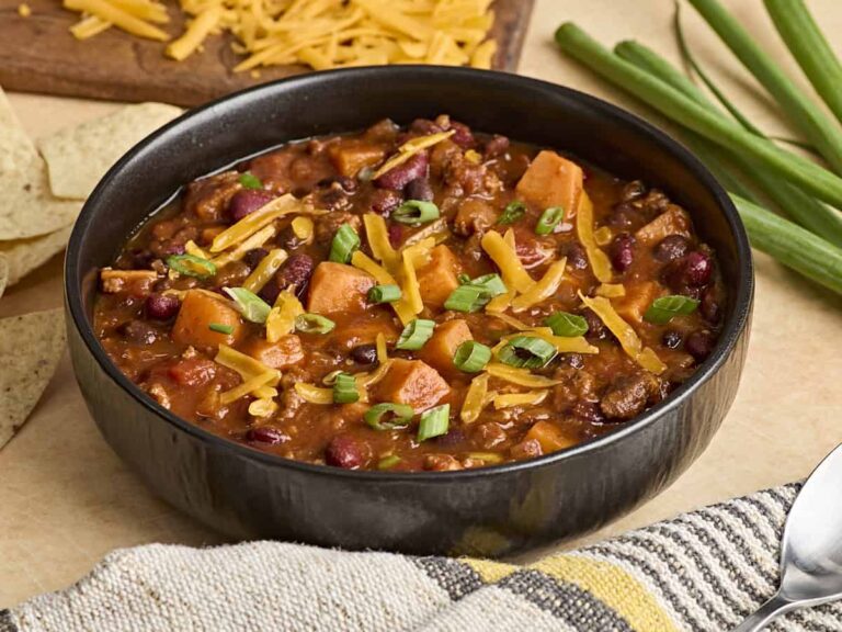 Side view of a bowl of chorizo sweet potato chili.