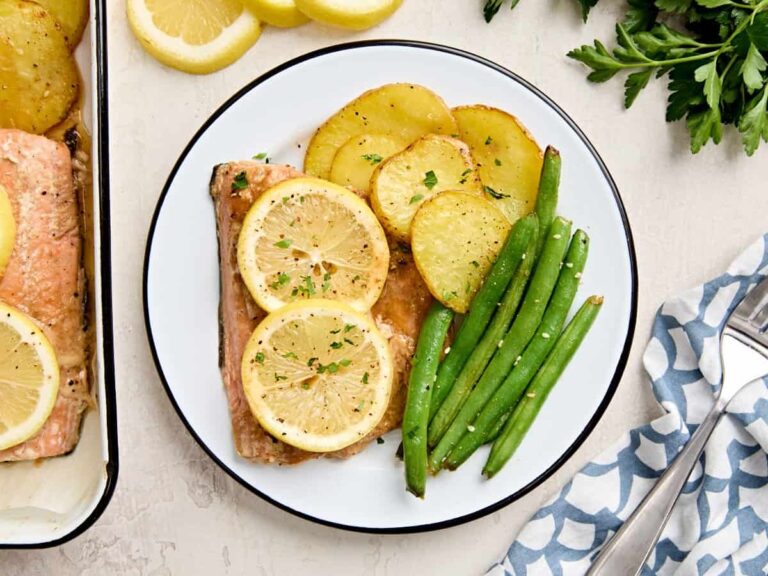 Overhead view of a one pan salmon dinner plated.