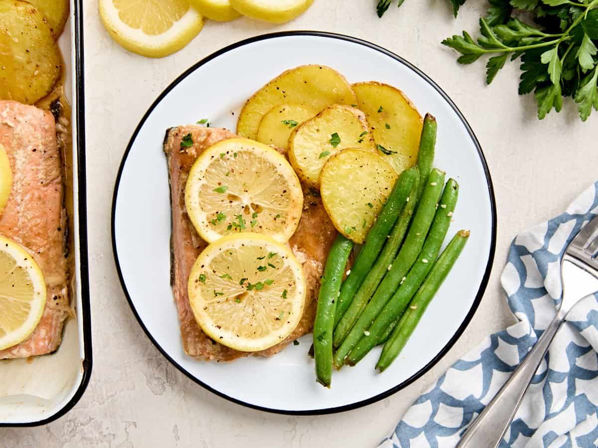 Overhead view of a one pan salmon dinner plated.