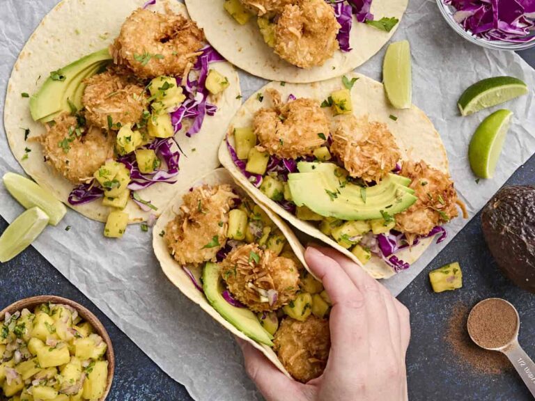Overhead view of coconut shrimp tacos with pineapple salsa.