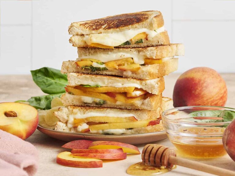 A stack of honey peach grilled cheese sandwiches.