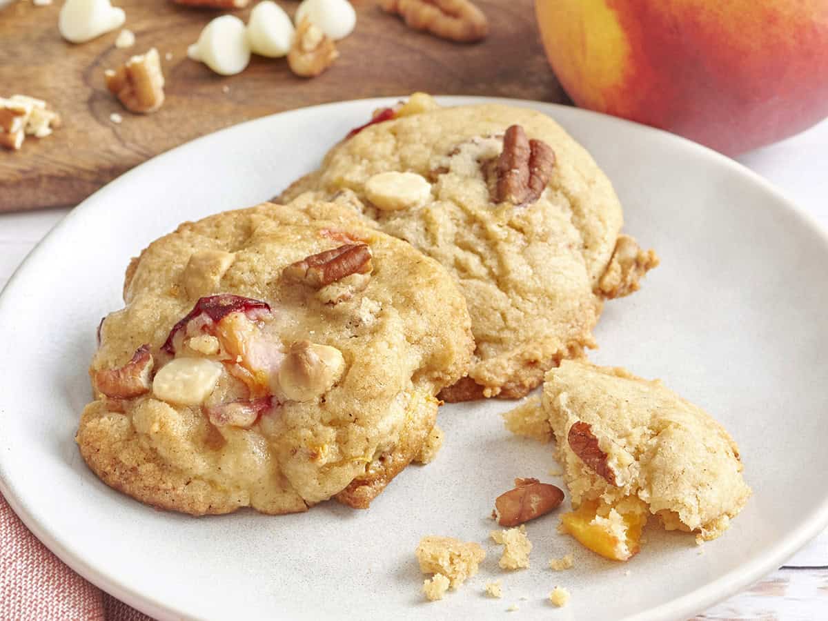 Side view of peaches and cream cookies on a plate.