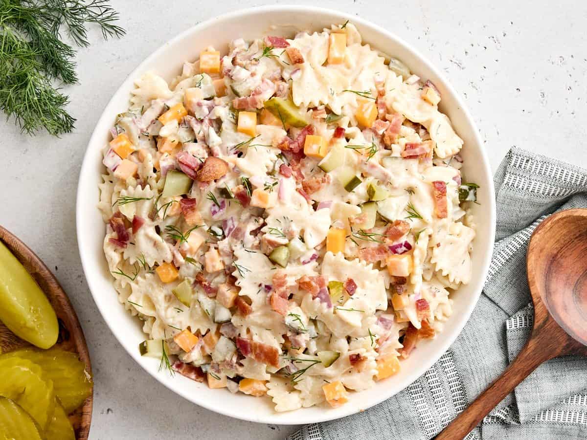 Overhead view of a bowl of dill pickle pasta salad in a bowl.