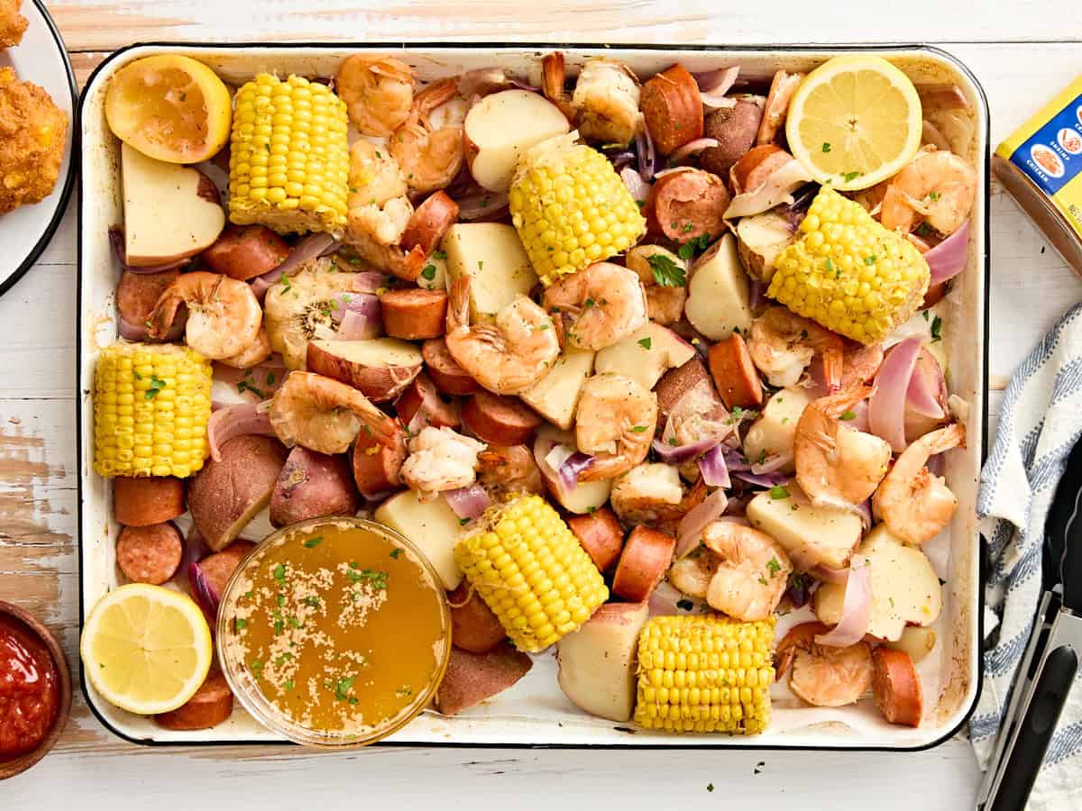 An overhead view of a shrimp boil on a sheet pan.
