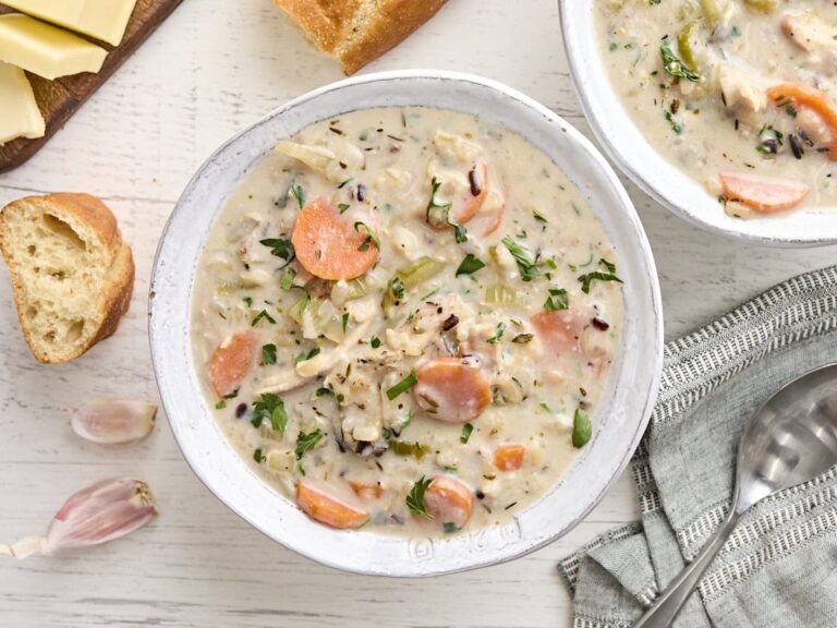 Overhead view of a bowl of creamy chicken and rice soup.