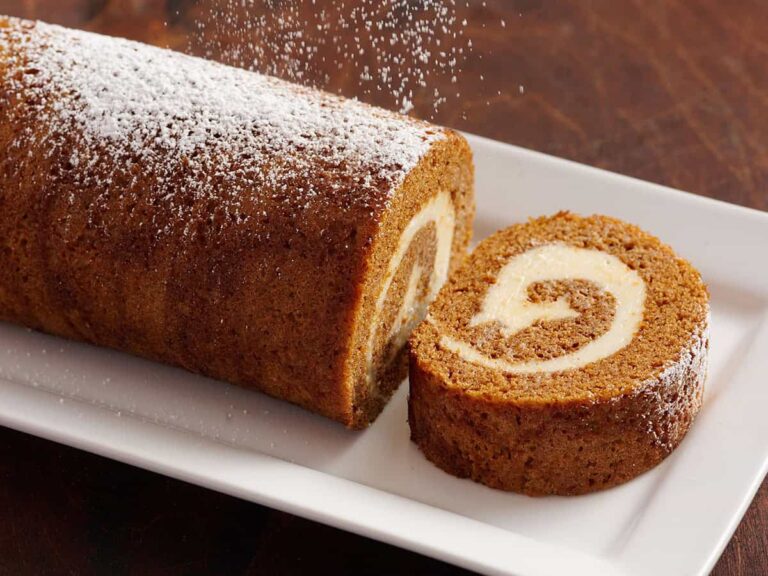 pumpkin roll dusted with powdered sugar