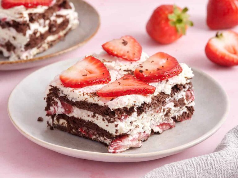 Side view of a slice of chocolate strawberry icebox cake.